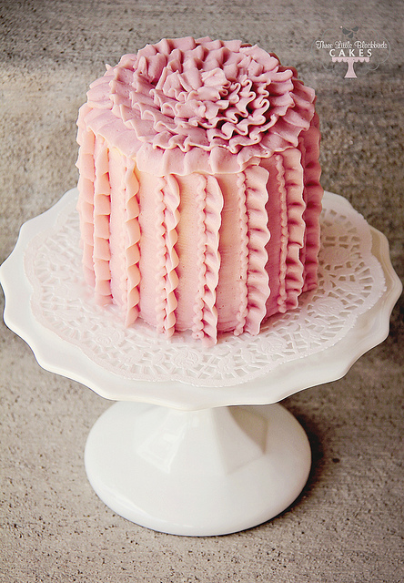 An organic strawberry buttercream piped on in a vertical ruffle design ...