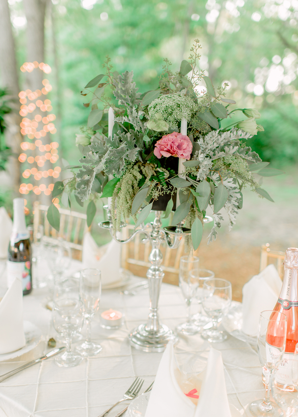 Tall candelabras were decorated with greenery and flowers for classic