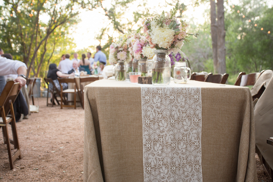 The reception tables featured burlap tablecloths with adorned with lace