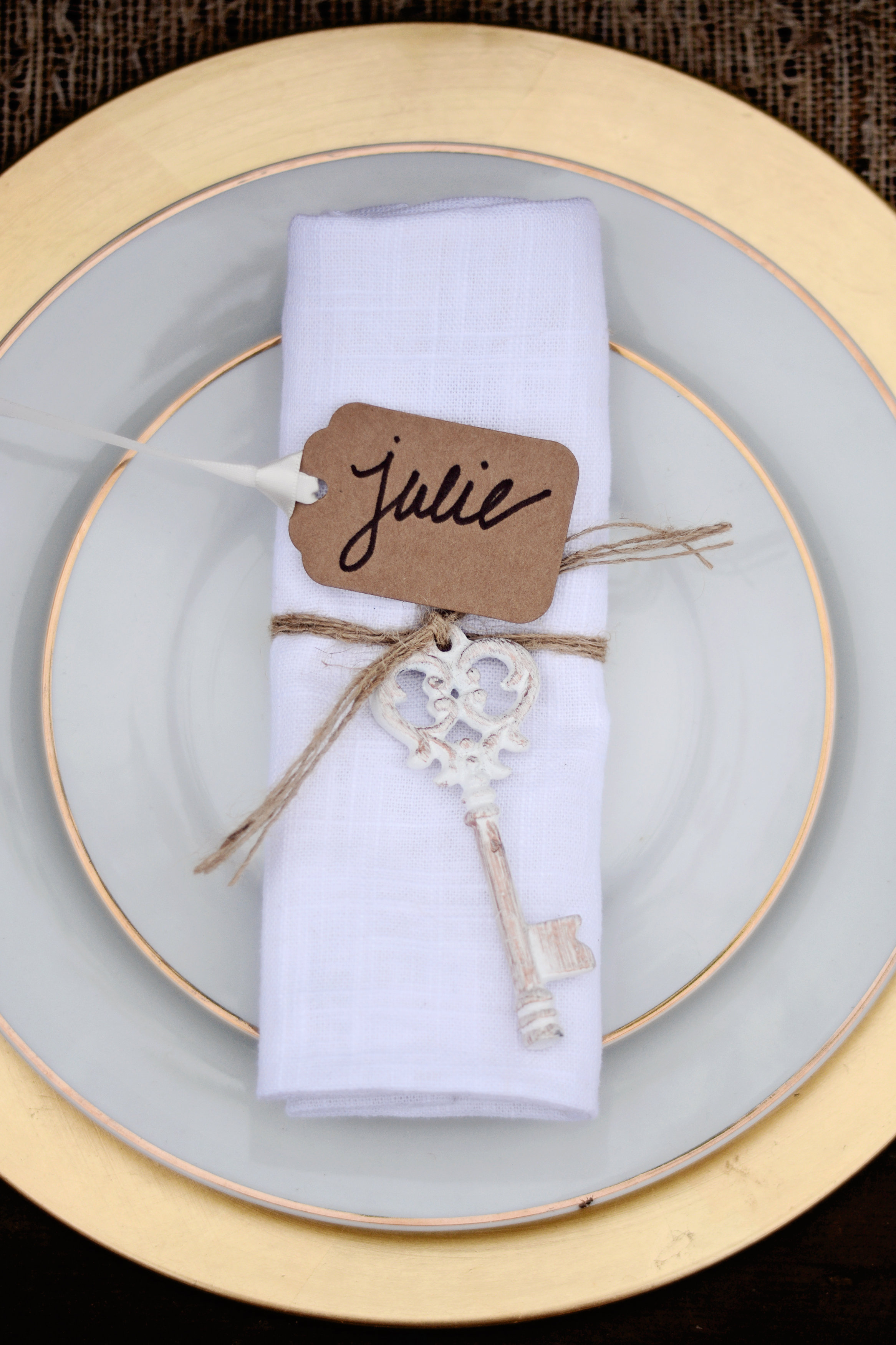 The place settings featured gold matte chargers gold rimmed dinner and